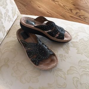 Clarks Artisan black leather slide sandal.